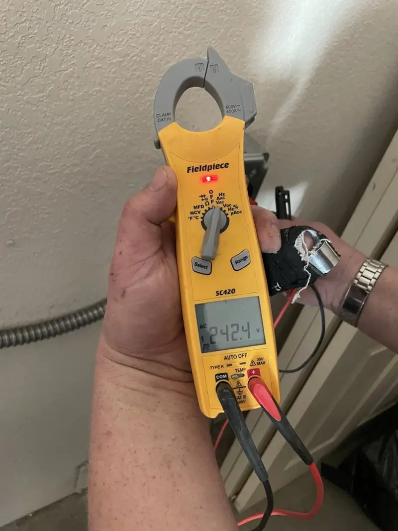 Voltage testing with clamp meter during Electrical Installation Services in Sebring